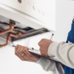 professional plumber doing a boiler check 6mya3mf 1