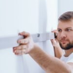 worker checking the wall panffwc 1