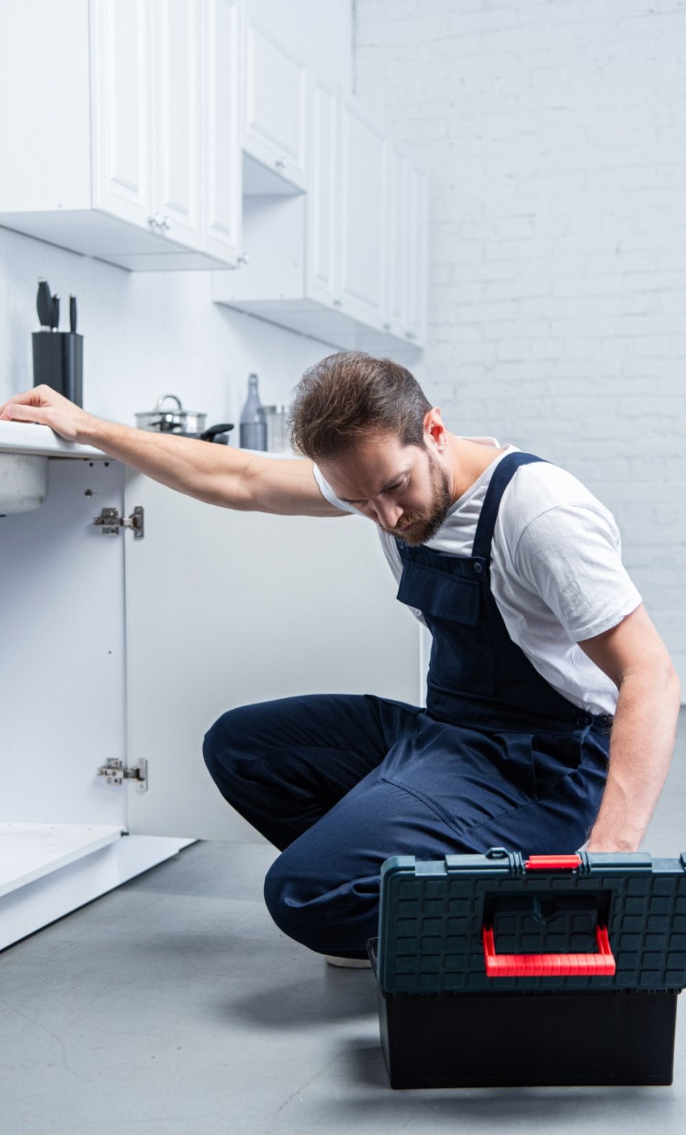 handsome adult repairman with toolbox checking sin scerlve 1.jpg