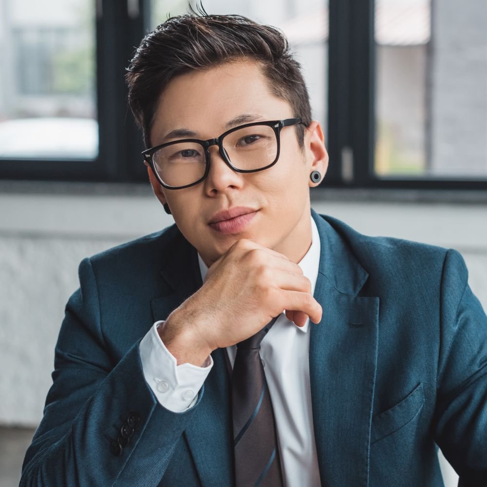 handsome young asian businessman in suit and eyegl qnr7z5e 1.jpg